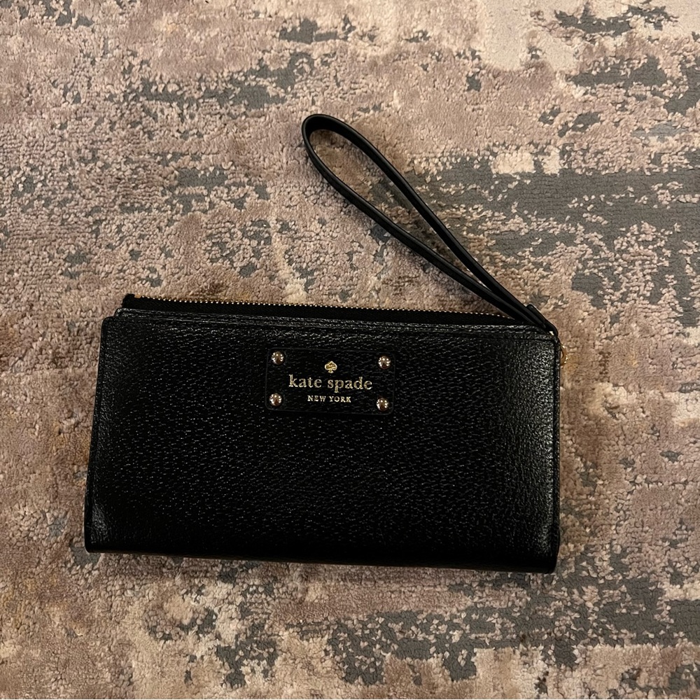Kate spade black wrist wallet, brand new. Multiple pockets, pink inside